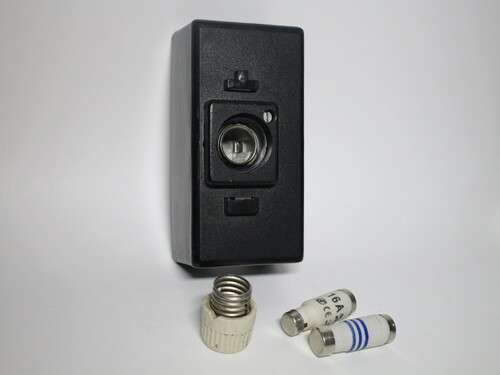 View of the fuse holder with the fuse and screw cap removed.