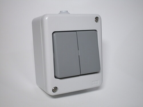 Surface-mount light switch, with two switches.