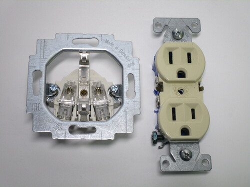 View of the sockets with the faceplates removed. The wire terminals are visible.