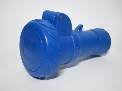 Single-phase socket. A lid is present on the front and is hiding the contacts. It's also made entirely of blue plastic.