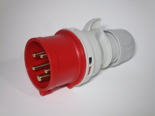 Three-phase plug. The body is made of grey plastic with a red section at the front.