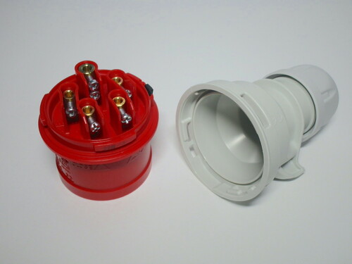 Internals of the plug. The terminals are classic screw terminals. Around them there's a small raised plastic section.