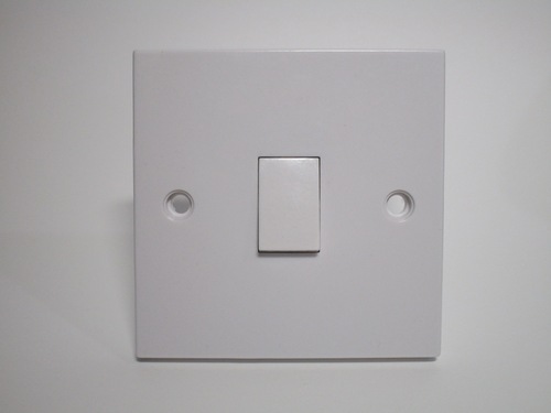 Front of the light switch. There's just a small lever to turn the lights on or off. Two screw holes are visible.