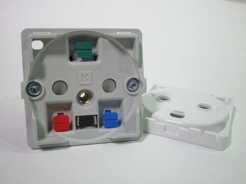 Socket with the faceplate removed. The mounting screws are visible, as well as coloured levers to disconnect the wires. The earthing contact is also visibile - it has to stick out quite far to ensure that the earth gets connected first.