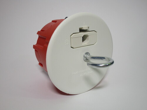 DCL socket, with plug inserted. A hook is present to hang the light fixture. The plug is sitting flush with the socket.