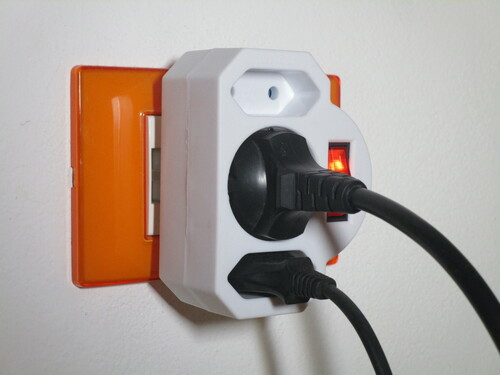 View of the adaptor plugged into an Italianised Schuko socket.