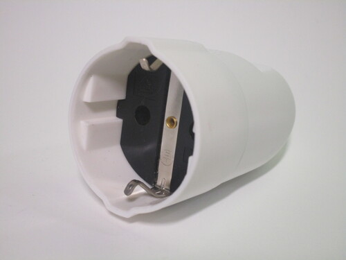 Connector socket. The main body is made of white plastic while the interior part is black.