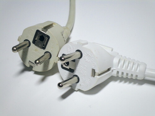 CEE 7/7 plugs moulded onto two power cords. The second one has the cord at a 90 degree angle.