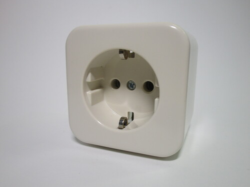 Front view of the socket. It's made of beige plastic, and is rather small.