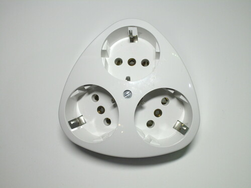 Front view of the socket. It has three outlets, arranged in a triangular shape.