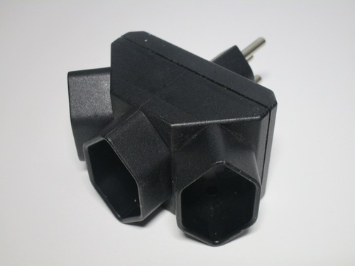 Side view of the adaptor. It has three recessed sockets.