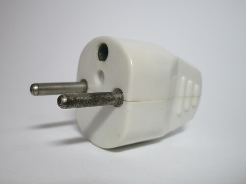 Front of the T14 plug. It has two pins and a hole with a contact for the earth pin on the socket.