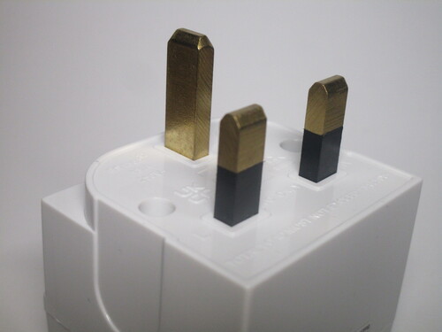 UK plug with sleeved pins.