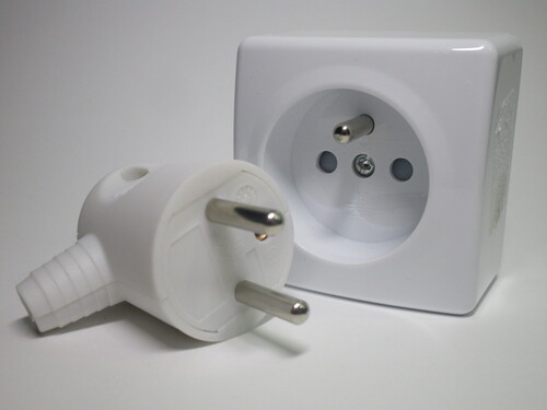 French plug and socket; the socket is recessed.